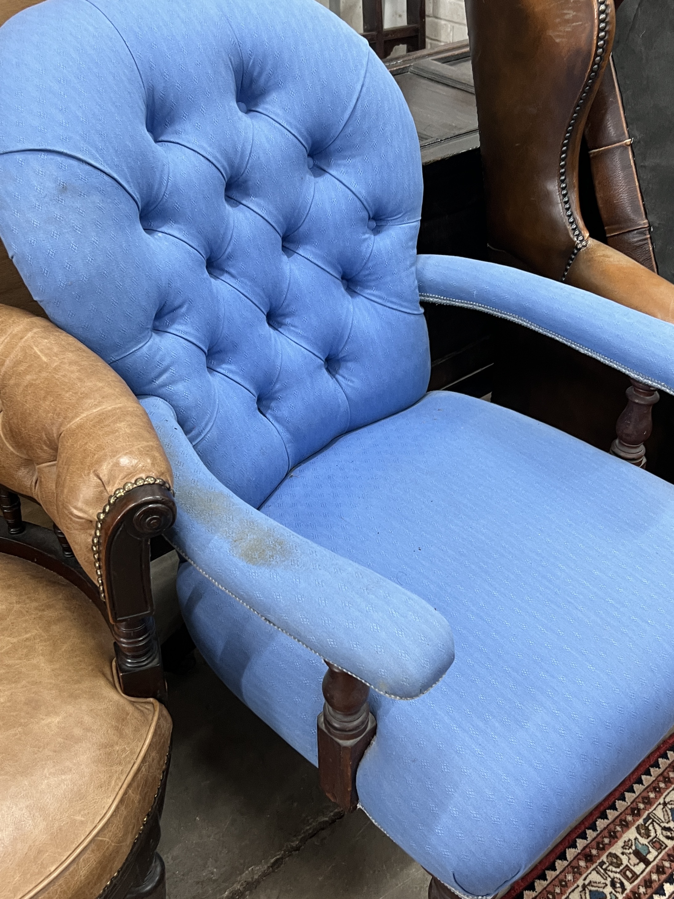 A late Victorian mahogany buttoned brown leather swivel desk chair, width 64cm, depth 56cm, height 74cm, together with a Victorian spoonback open armchair